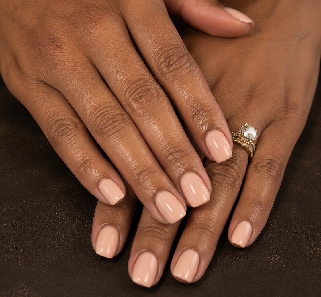 Natural nails finished with a soft nude Luminary overlay